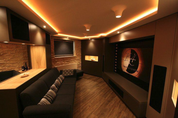 Custom home theater and media room renovation with built-in cabinetry